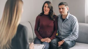 Genetic counseling consultant advising couple during pregnancy