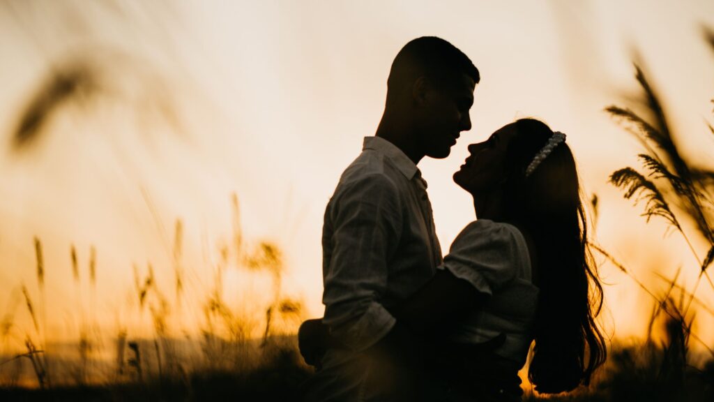 Silhouette of Man and Woman Embracing