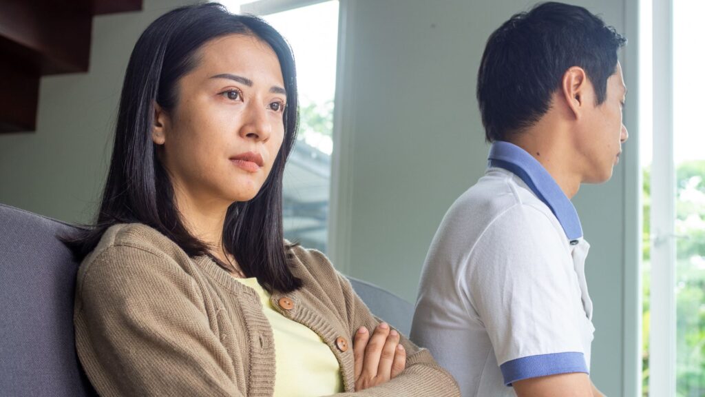 Couple with Problems Sitting on a Sofa